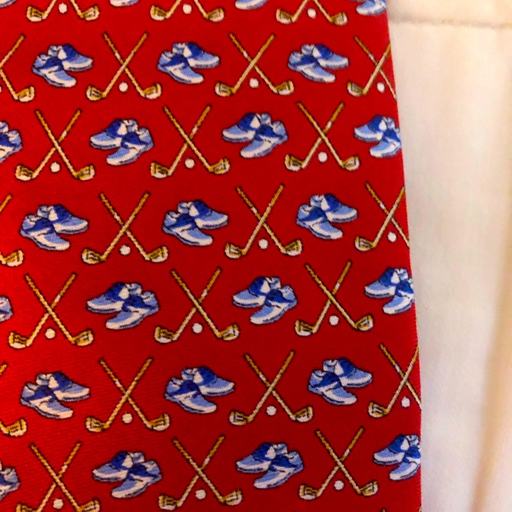 Red golf club and shoes tie